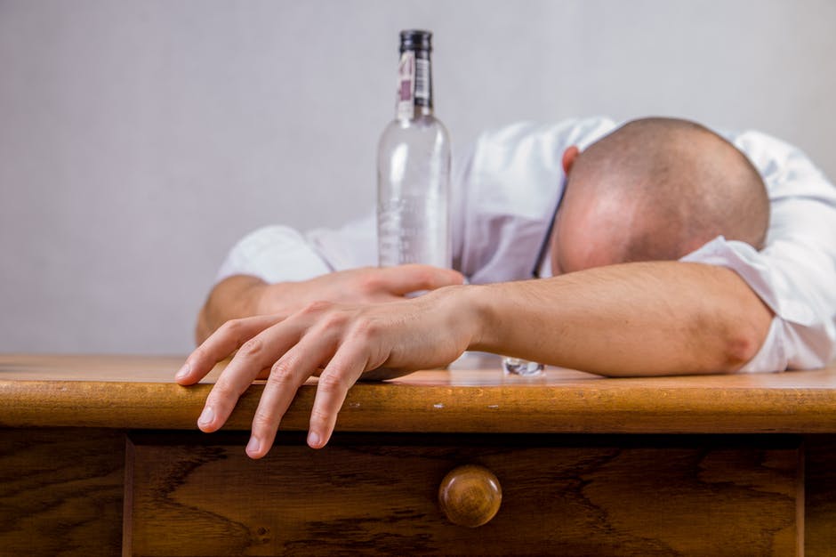 person hungover needs to quit drinking